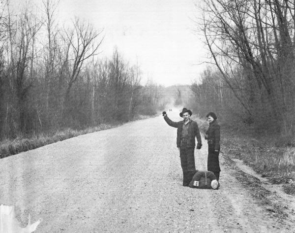 A man and woman hitchhiking near Vicksburg, Mississippi in 1936